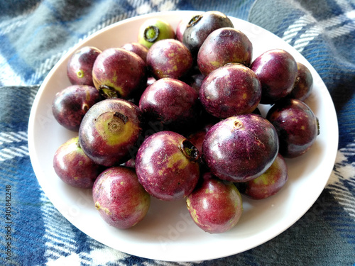 Buah Kaliasem or Kaliasem fruit that is good to eat. Kaliasem Fruit that is often sold in Bali. Delicious fruit for Rujak photo