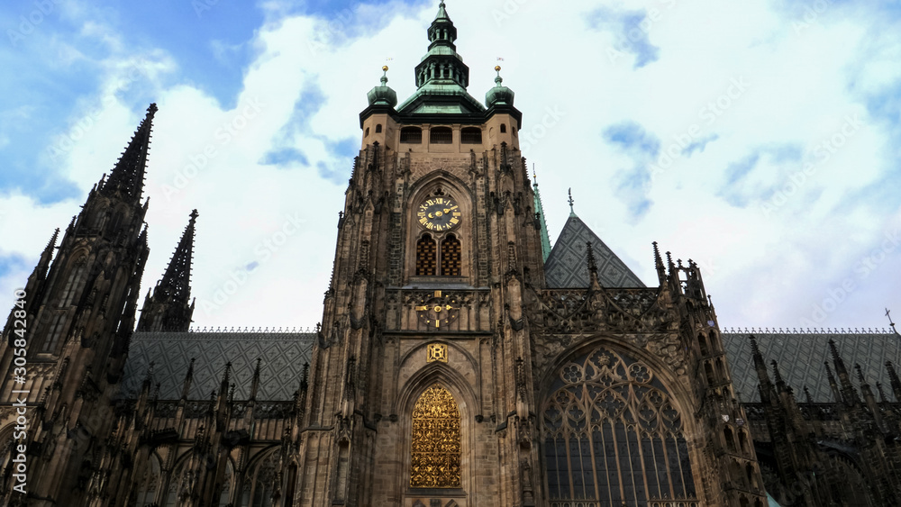 Obraz premium shot of the clock tower of st vitus cathedral in prague