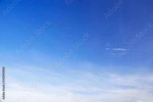 Blue sky background and white clouds soft focus, and copy space