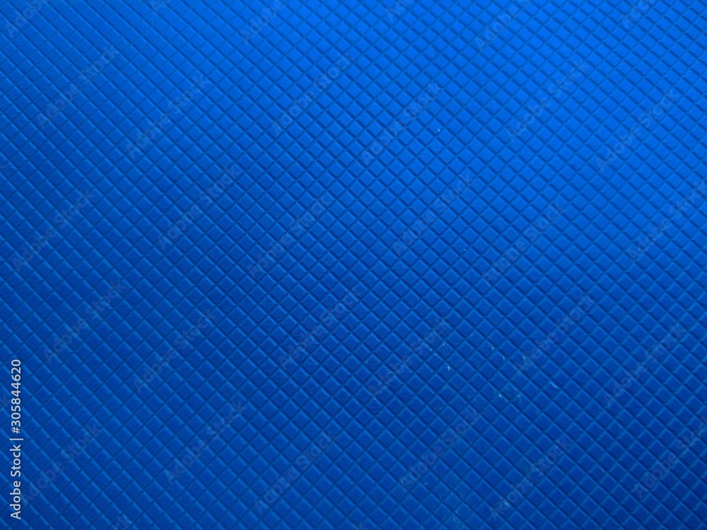 Closeup of the texture of a blue notebook cover. Closeup of the texture of a blue notebook cover.