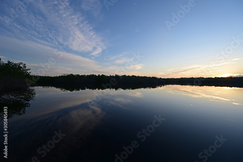 Sunrise cloudscape reflected on calm water of West Lake in Everglades National Park  Florida.