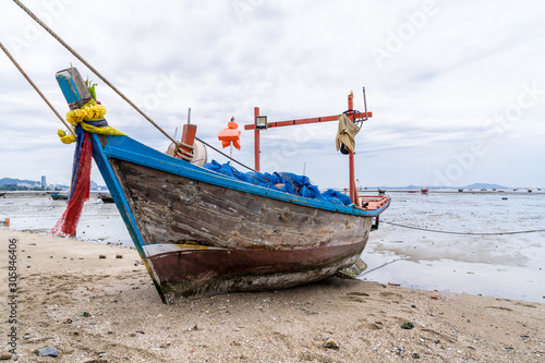 Fishing boats are parked on the beach.