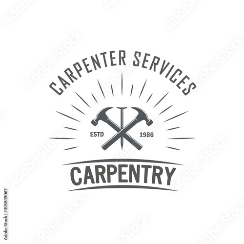 Black and white illustration of the logo of a carpentry workshop. Vector illustration of crossed hammers, nail and rays with text on a white background. Professional carpenter services.