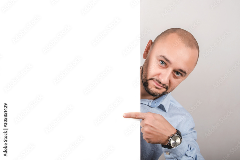 Man points to a place for the text. Man points to a place for the text.