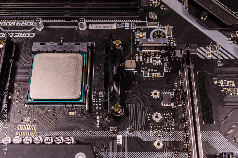 Closeup of the new modern computer motherboard with installed cpu Stock  Photo | Adobe Stock