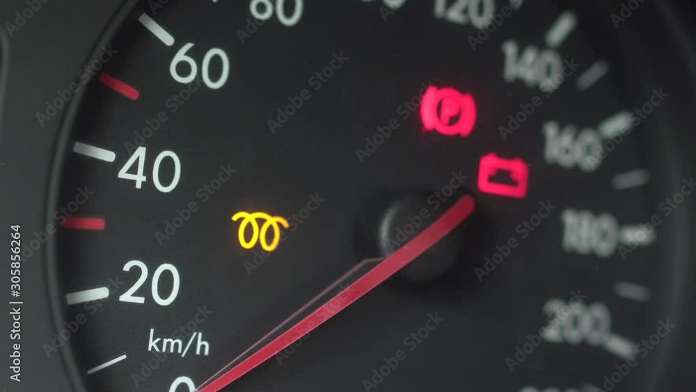 Spiral icon indicating the inclusion of glow plugs on a diesel engine. Cold start of a diesel engine in winter. Closeup indicators on the speedometer display turn on and light up. Response to engine Spiral icon indicating the inclusion of glow plugs on a diesel engine. Cold start of a diesel engine in winter. Closeup indicators on the speedometer display turn on and light up. Response to engine