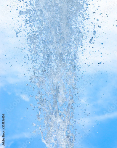 splashing water against blue sky