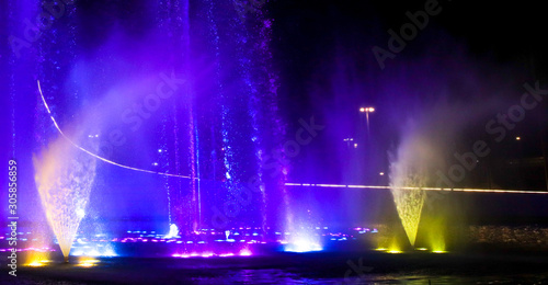 A dancing fountain of blue in the park