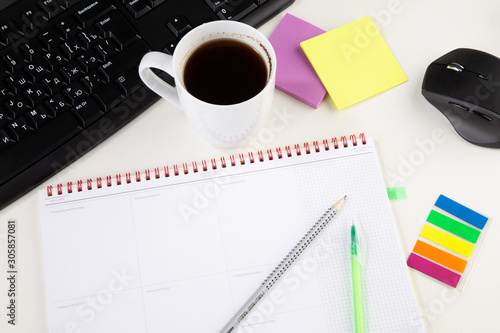 Office workplace table with supplies and coffee cup. Flat lay. Top view with space for your text