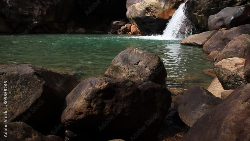 Beautiful Veal Pouch Waterfalls also called Secret Waterfalls, a popular hiking attraction in Kampot Cambodia shot in slow motion Beautiful Veal Pouch Waterfalls also called Secret Waterfalls, a popular hiking attraction in Kampot Cambodia shot in slow motion
