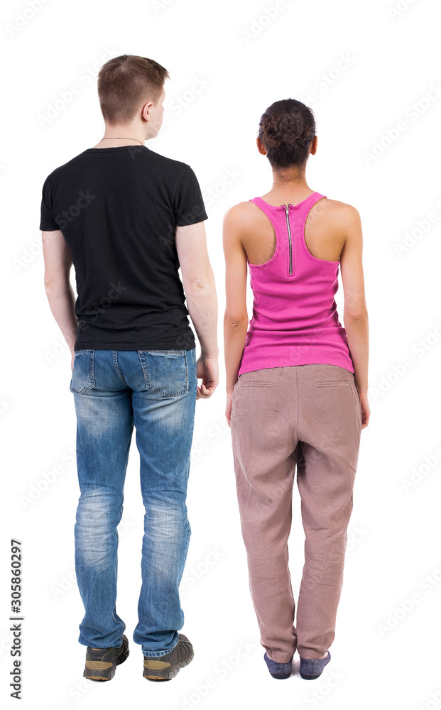 Back view of couple. beautiful friendly girl and guy together. Back view of couple. beautiful friendly girl and guy together.