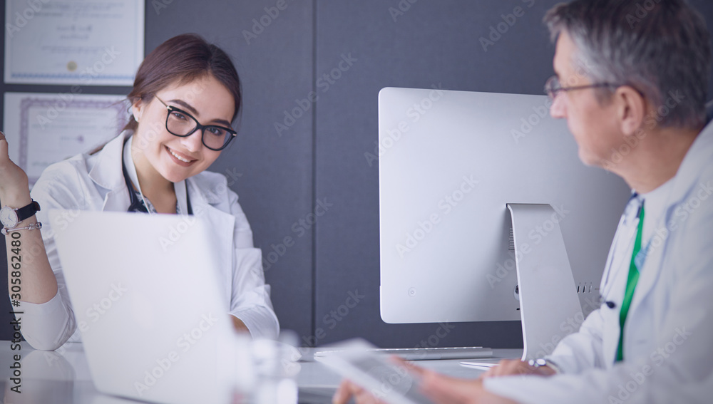 Doctors having a medical discussion in a meeting room Doctors having a medical discussion in a meeting room