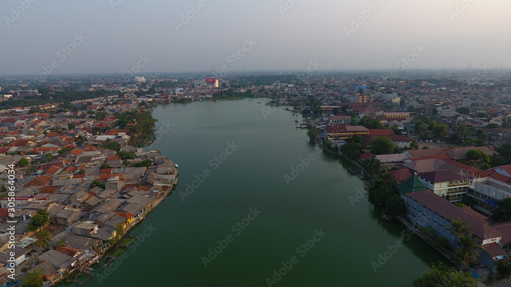 green lake in the middle of urban areas