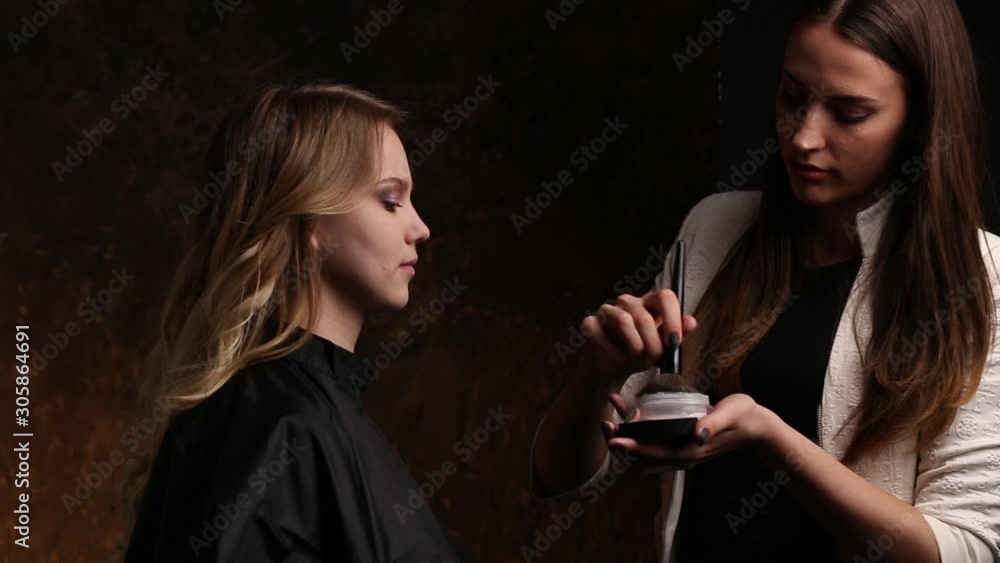 Professional makeup for a young girl on a black background Professional makeup for a young girl on a black background