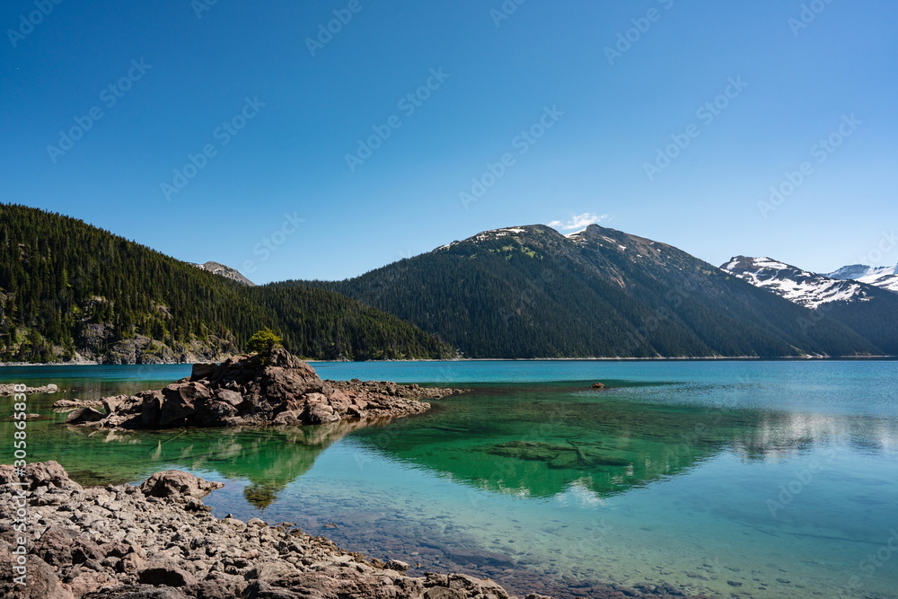 Turquoise coloured lake and snow mountains  in Garibaldi provincial park, BC, Canada