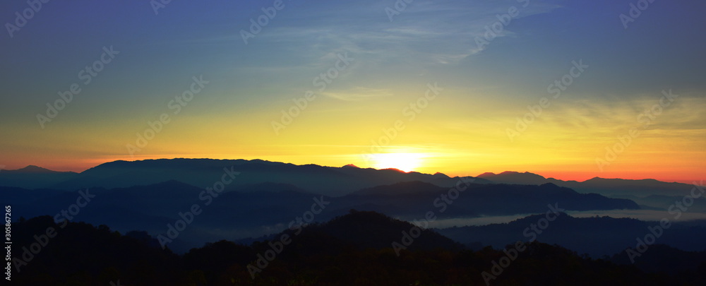 A view of the sky, mist, mountain view in the morning before dawn, looking up from the peak.Sunrise in the morning at the high hill
