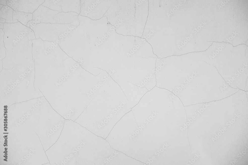 Close-up of White cement wall peeled paint caused by water and sunlight. Peel wall of White house paint with black stain. Black and White of Texture background. Close-up of White cement wall peeled paint caused by water and sunlight. Peel wall of White house paint with black stain. Black and White of Texture background.