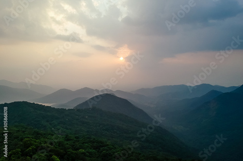 nice photo with clouds ,sun ans hills in maharashtra karnataka states in India © yurakrasil