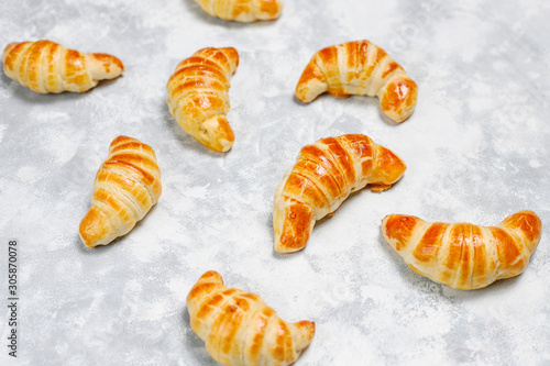 Wallpaper Mural Fresh tasty homemade croissants on grey-white background. French pastry Torontodigital.ca