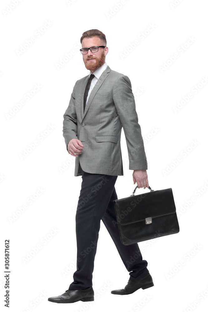 successful businessman with briefcase goes forward. isolated on white successful businessman with briefcase goes forward. isolated on white