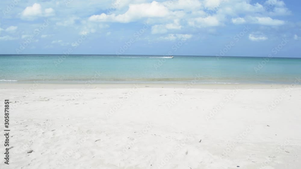 Tropical sandy beach at andaman sea with cloudy blue sky. scenery of karon beach under sunlight during summer in phuket. Thailand. Tropical sandy beach at andaman sea with cloudy blue sky. scenery of karon beach under sunlight during summer in phuket. Thailand.