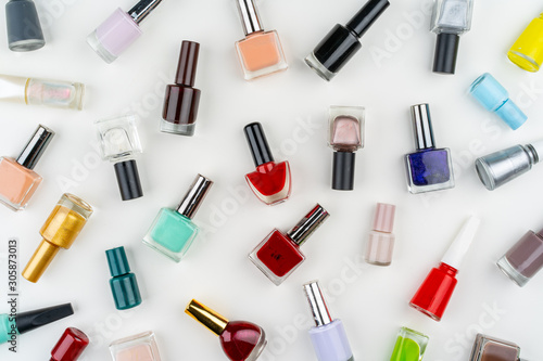 Top view of nail polish bottkes cosmetics pattern