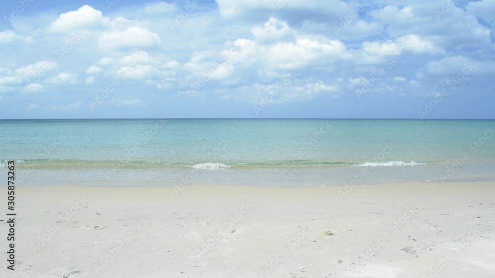 Tropical sandy beach at andaman sea with cloudy blue sky. scenery of karon beach with clear water under sunlight during summer in phuket. Thailand. Tropical sandy beach at andaman sea with cloudy blue sky. scenery of karon beach with clear water under sunlight during summer in phuket. Thailand.