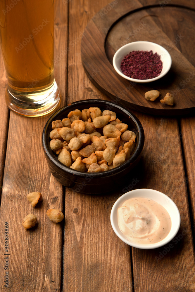 mini fried dumplings as beer snack served with sauce and sumac mini fried dumplings as beer snack served with sauce and sumac