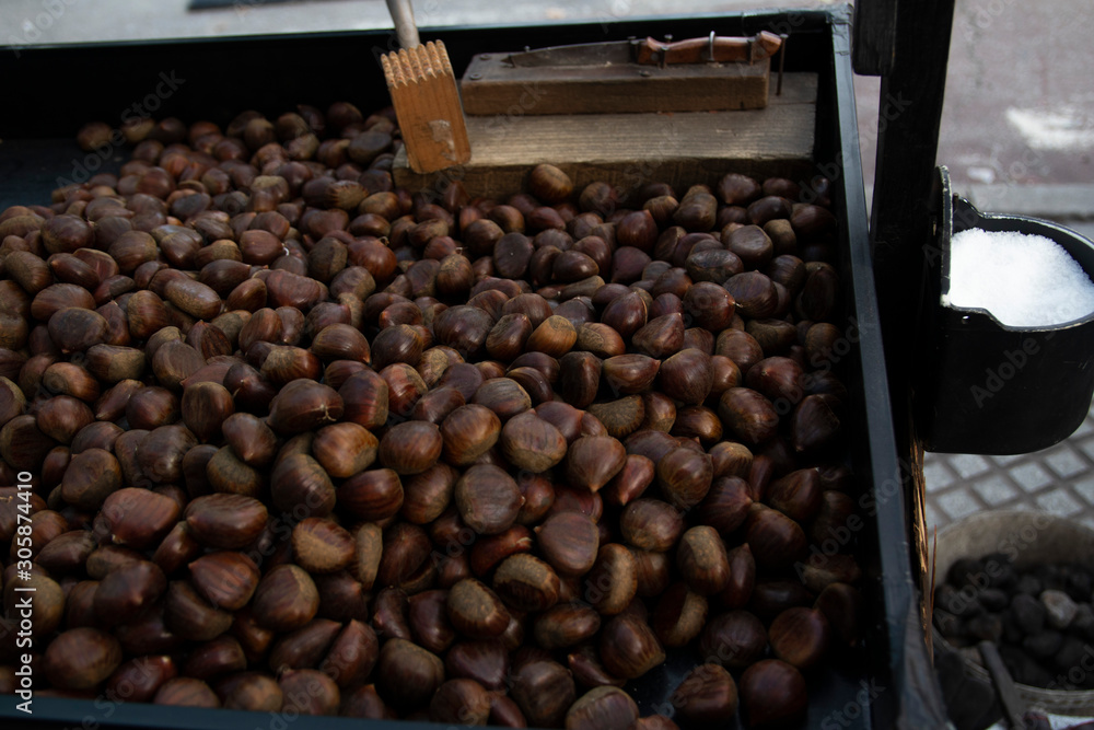 Chestnuts prepared for roasting in a street stall
