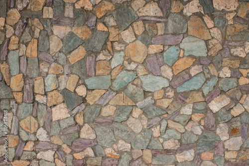 texture of stone wall. decorative stone, different colors. street tiles on the ground