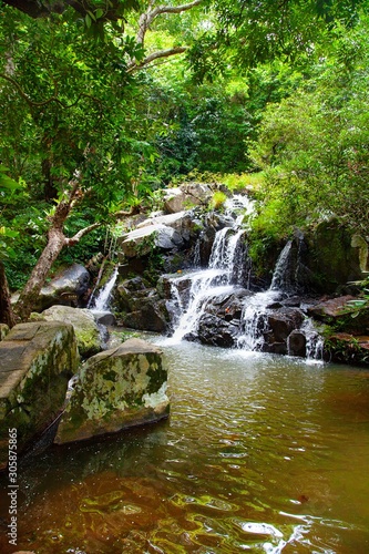 Nature Tropical Waterfall Lanscape with foliage and stones © Kisika