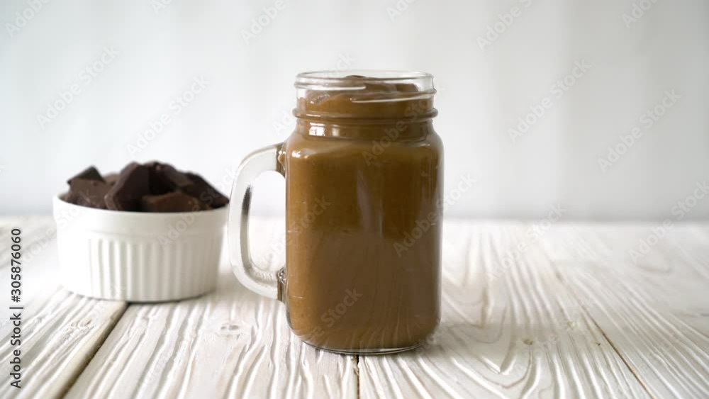 chocolate milkshake smoothie on wood table chocolate milkshake smoothie on wood table