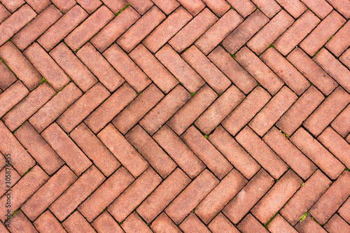 Reddish herringbone tile pattern background