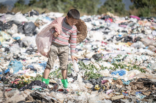 Poor children collect garbage for sale because of poverty, Junk recycle, Child labor, Poverty concept, World Environment Day,