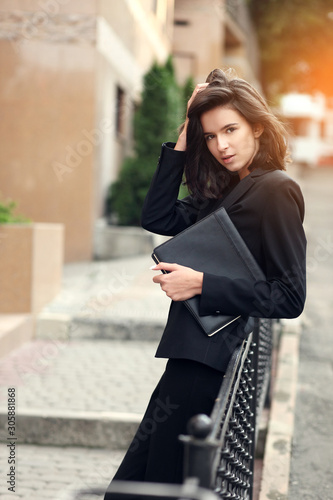 Portrait of business woman smiling outdoor © azhurfoto