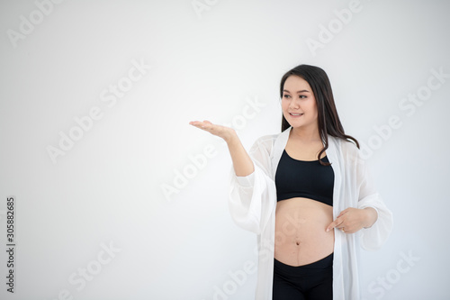 Pregnant women are showing a reaction with a smile