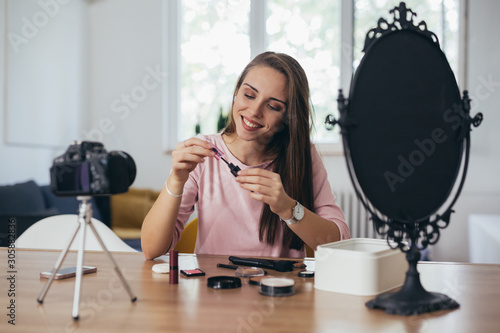 woman influencer making video about make up cosmetic