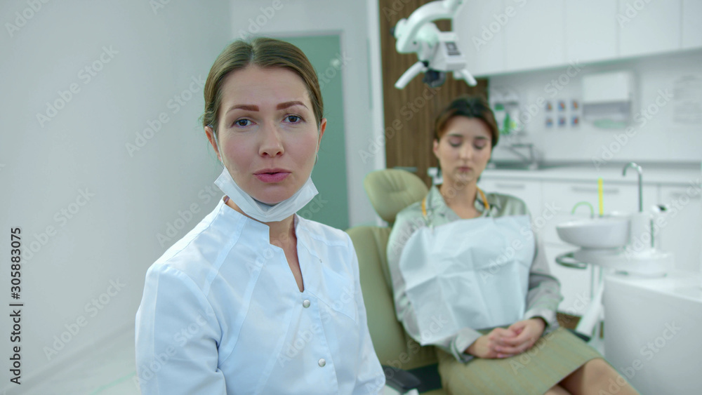 Dentist talks on camera in the cabinet