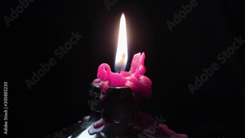 Candle burning black background