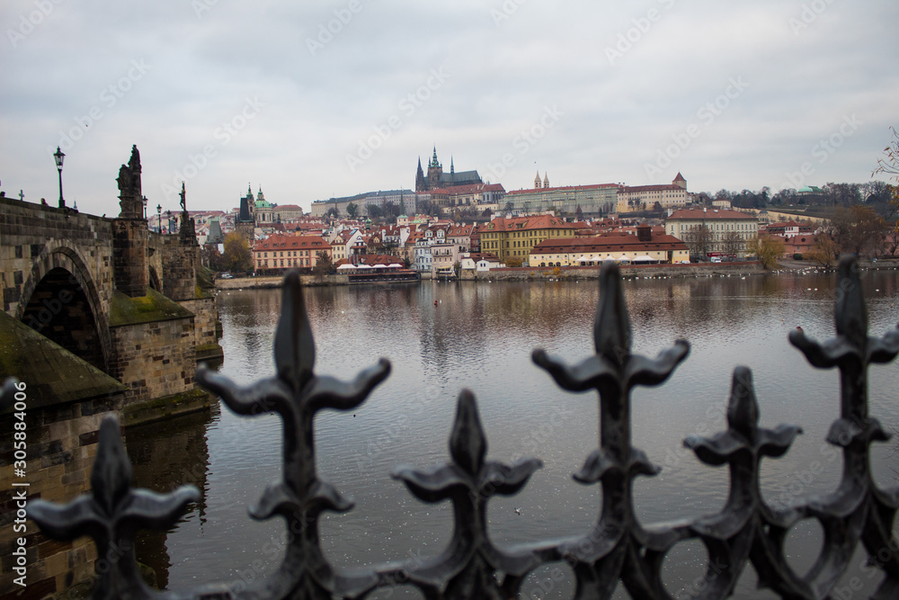 Obraz premium A masterpiece of architecture the famous Charles Bridge in the city of Prague, Czech Republic, on a cloudy morning on the eve of Christmas.