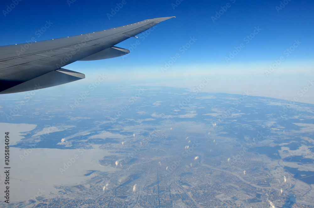 In flight picture from the window of a Boeing 777 over the city of Saint Petersburg In flight picture from the window of a Boeing 777 over the city of Saint Petersburg