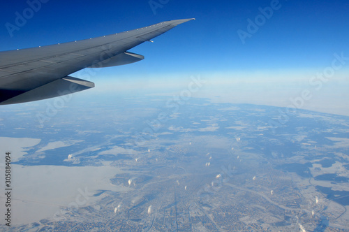 In flight picture from the window of a Boeing 777 over the city of Saint Petersburg