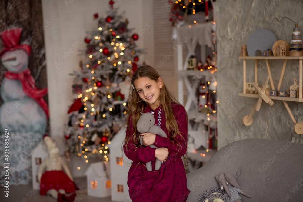 little girl near christmas tree