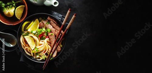 Tasty asian classic soup with noodles and meat