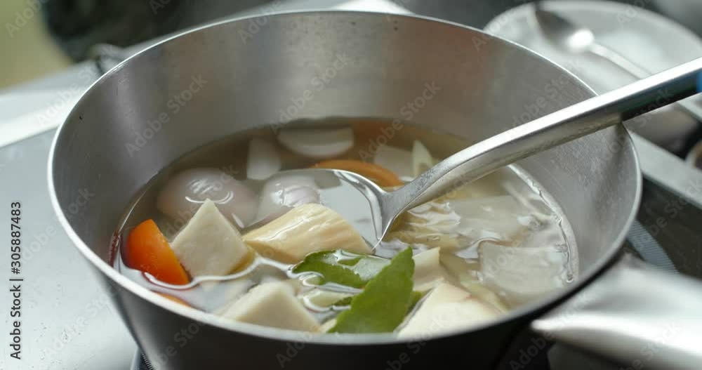 Cook Tom Yum soup in kitchen