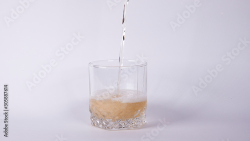 Glass with lemonade on a white background