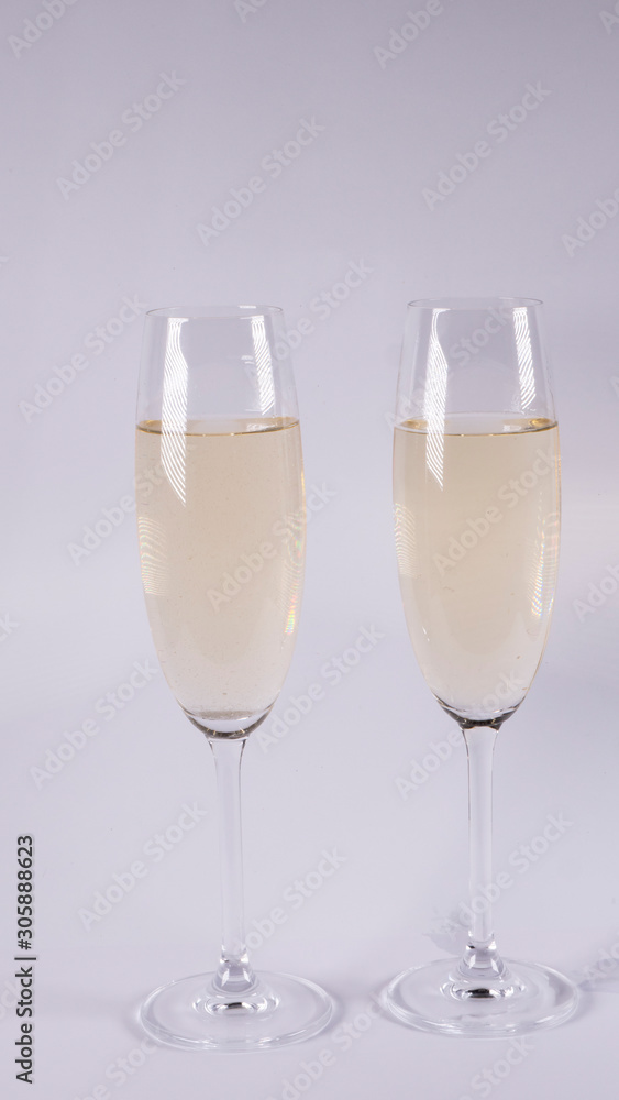 Two glasses with champagne on a white background Two glasses with champagne on a white background