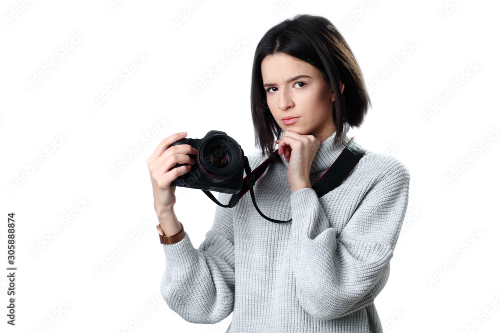 Fototapeta premium beautiful woman holding a photo camera. Isolated over white background