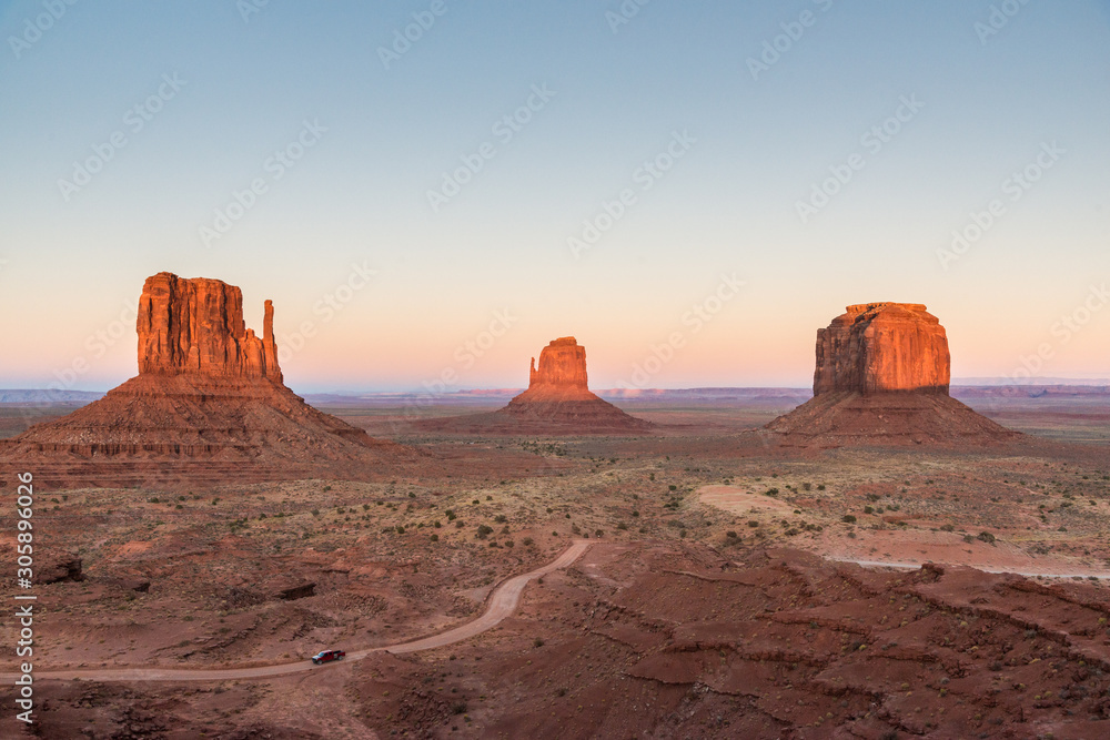 Sunset lighting the mesas in Monument Valley. A sunset view of the main plateau in Monument Valley, Arizona
