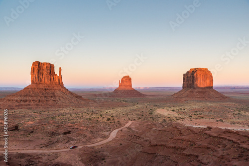 Sunset lighting the mesas in Monument Valley. A sunset view of the main plateau in Monument Valley, Arizona